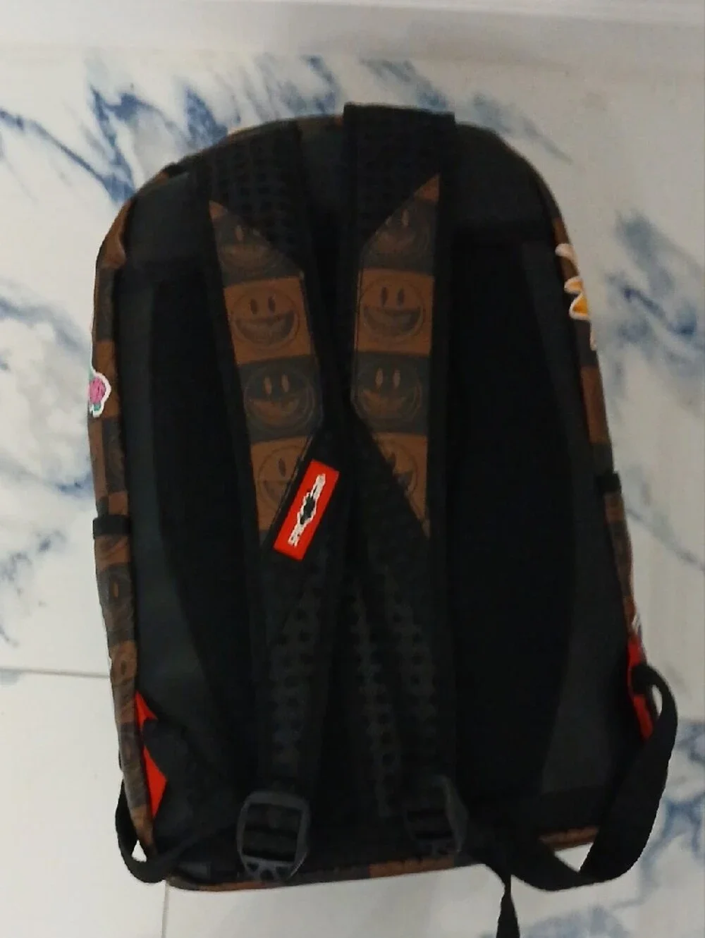 Sprayground Brown Checkerboard Backpack with Multicolor Sticker Graphics